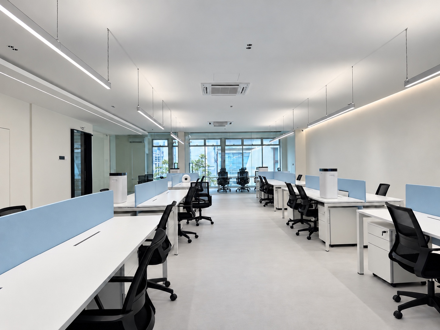 Office furniture setting with desks, task chairs and acoustic screens