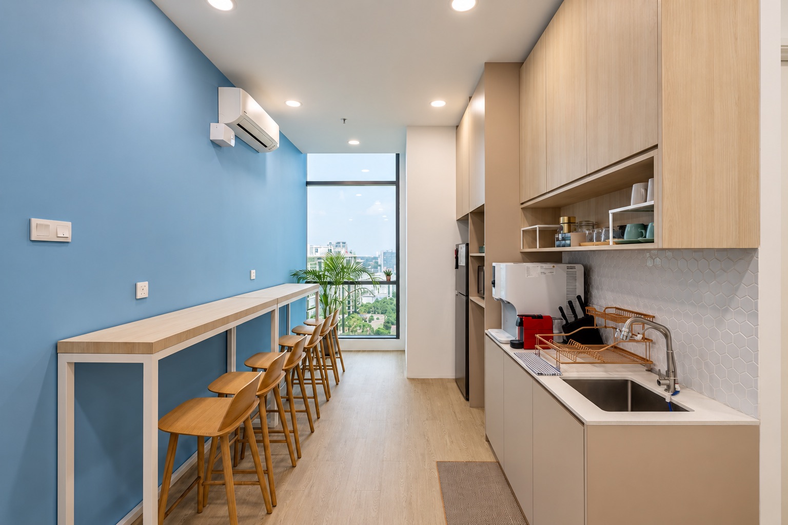 Office pantry with lighting, joinery, air-conditioning and plumbing requiring coordinated maintenance