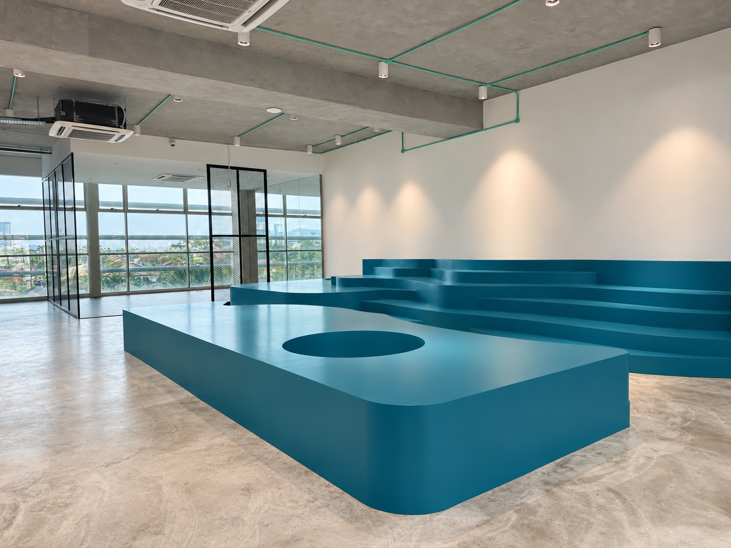 Blue sculptural amphitheatre at the Dasher workplace